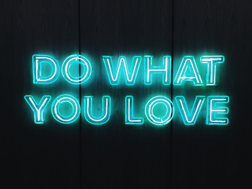 A neon sign that says "Do what you love"